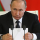 Putin, checking to see how his Brony/Iron Man slashfic is doing today. (Photo by Mikhail Svetlov/Getty Images)